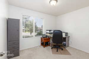 Room with neutral carpeting and white wall paint