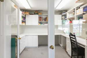 Great office or craft area!  Lots of shelving and light!