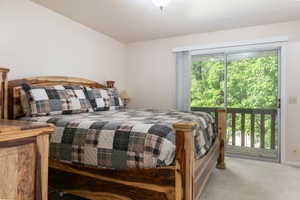 Primary bedroom with access to deck.