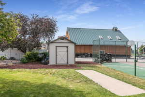 The .42 acre lot ends behind the sport court and shed. Most of the yard is fenced.