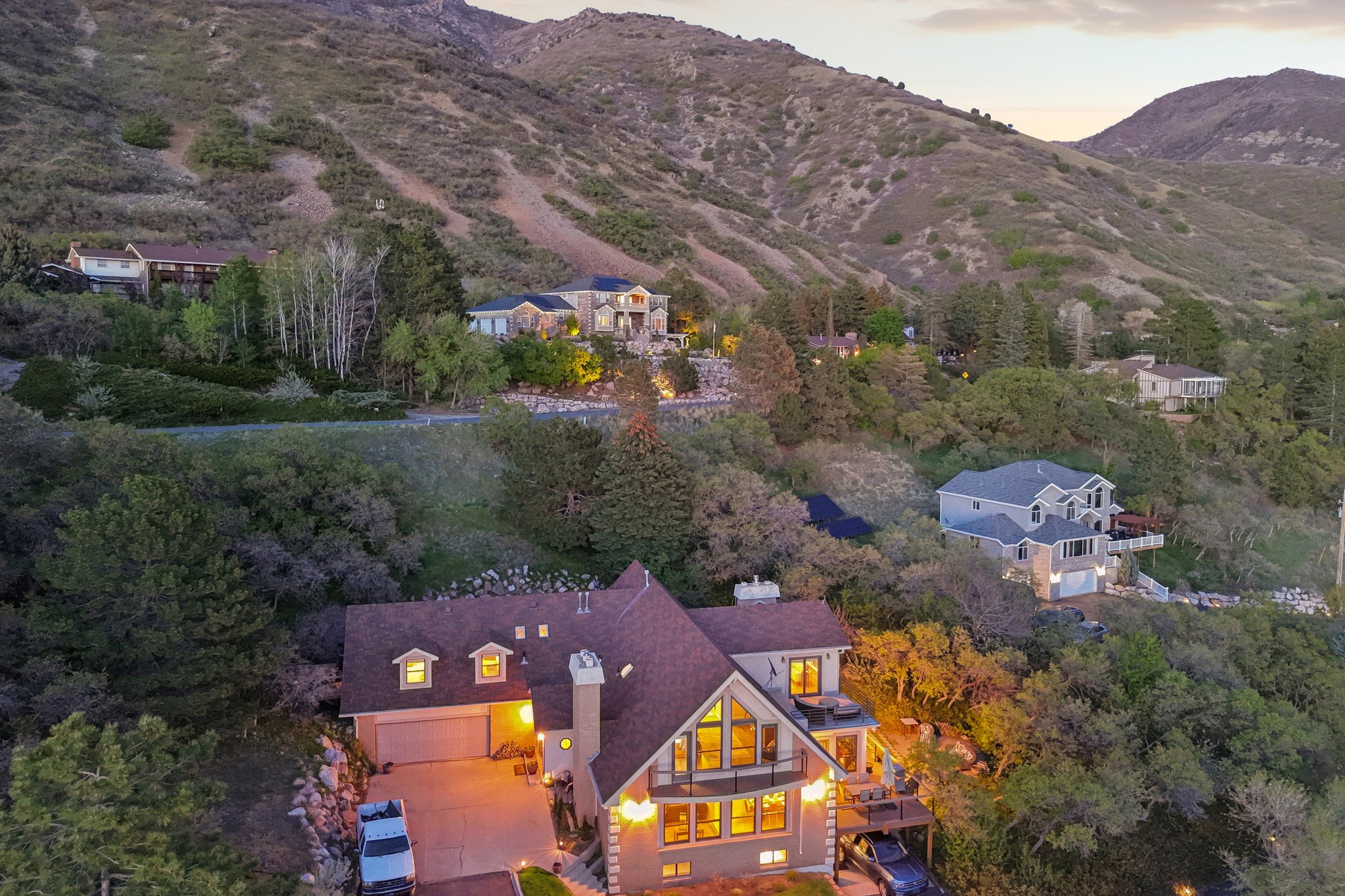 Hillside residence featuring a multi-level design and extensive natural landscaping