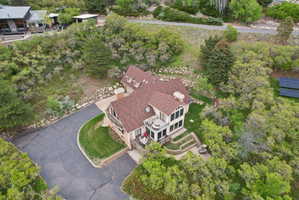 Two-story residence featuring a multi-gabled roofline and multiple dormer windows