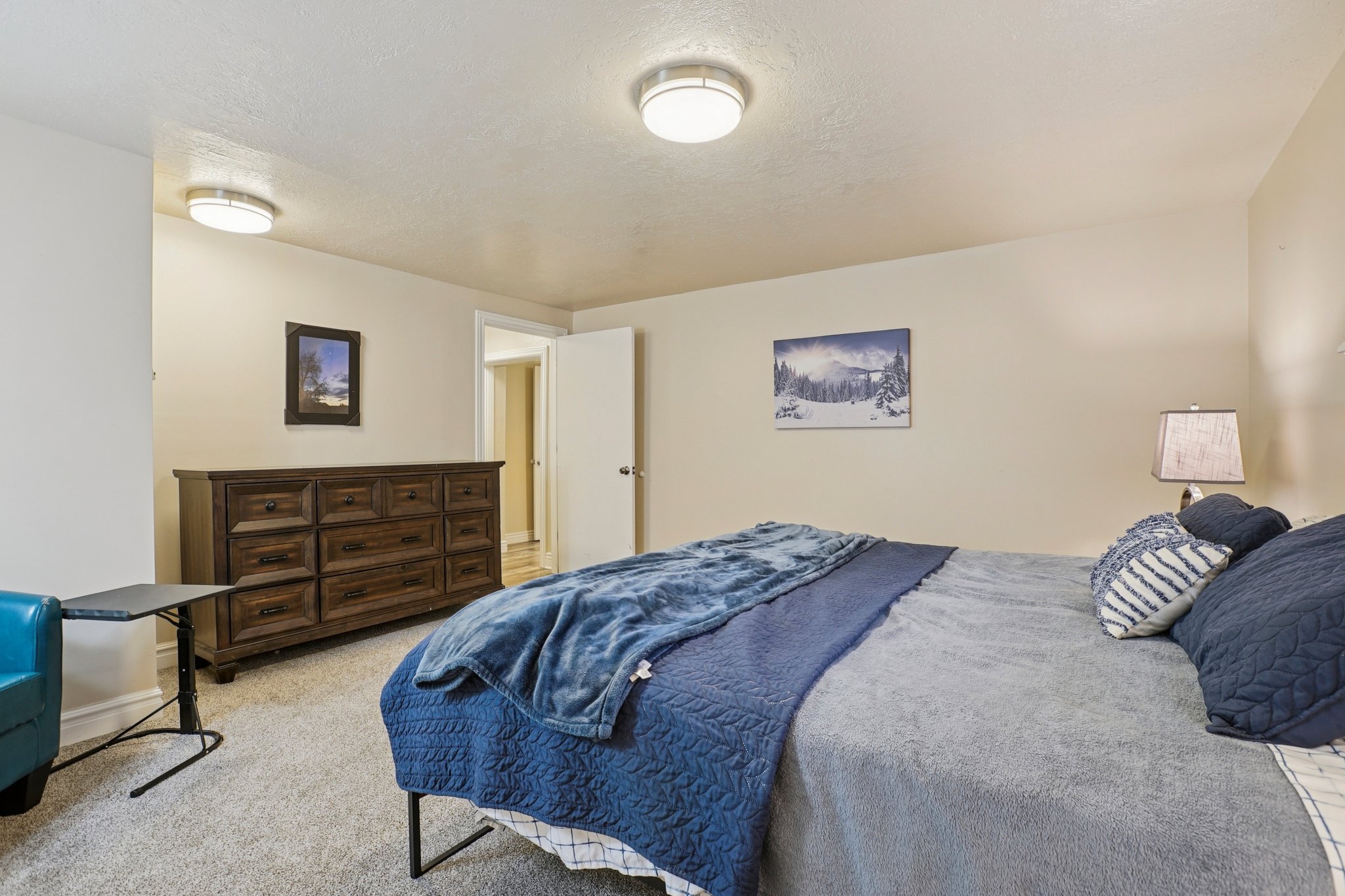 Carpeted room with neutral wall tones and a white ceiling