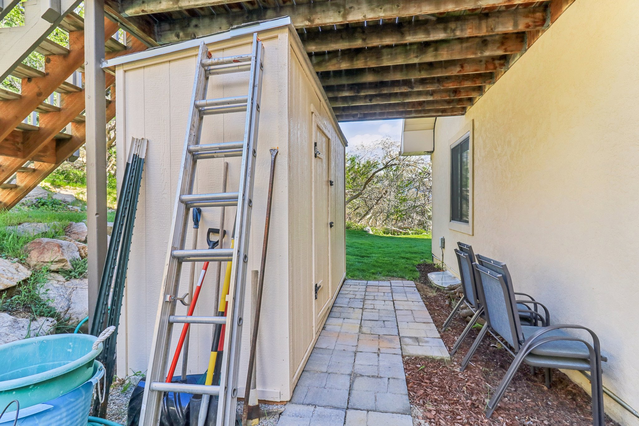 Outdoor storage shed with panel siding