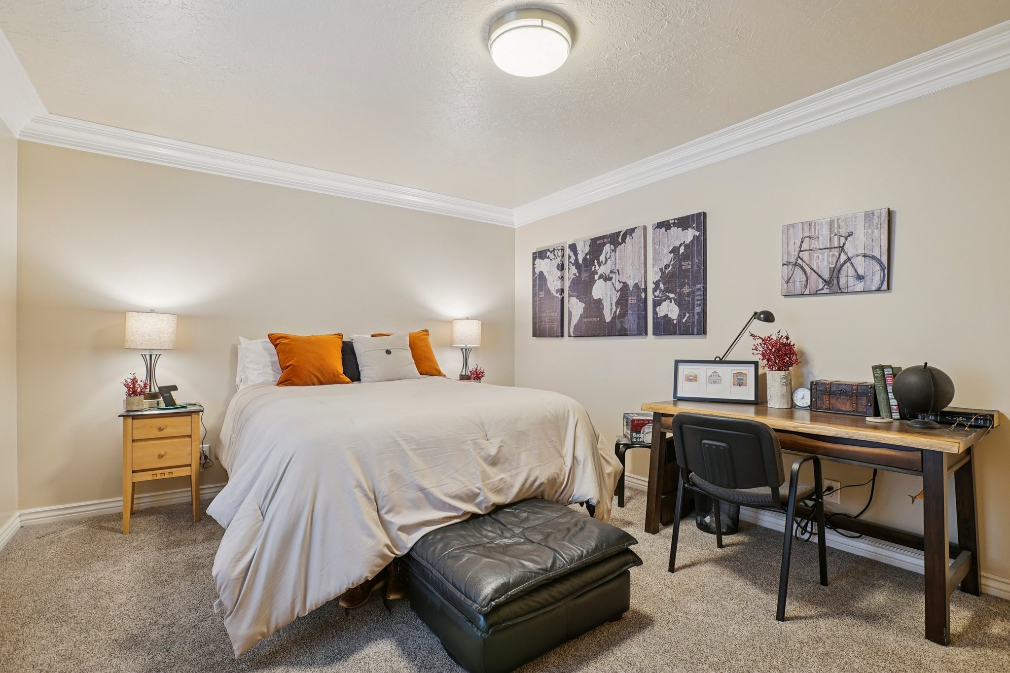 Carpeted room featuring crown molding, neutral wall paint, and a built-in ceiling light fixture