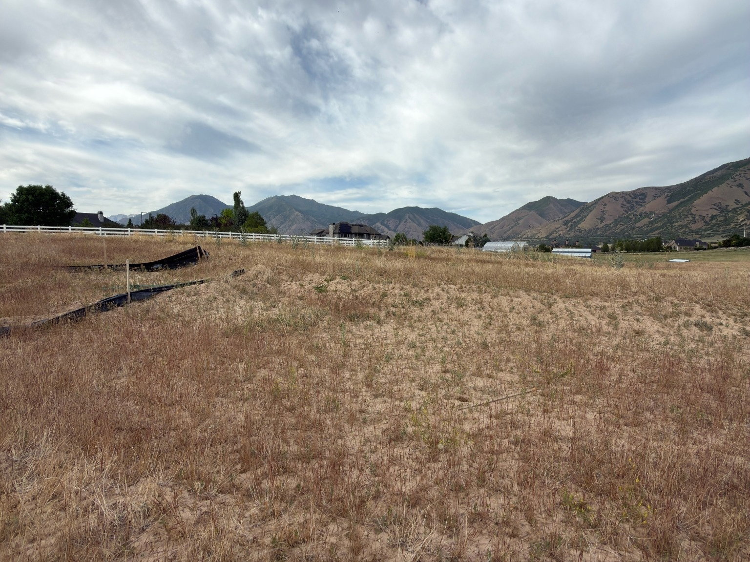 Expansive land parcel featuring open terrain and distant mountain range