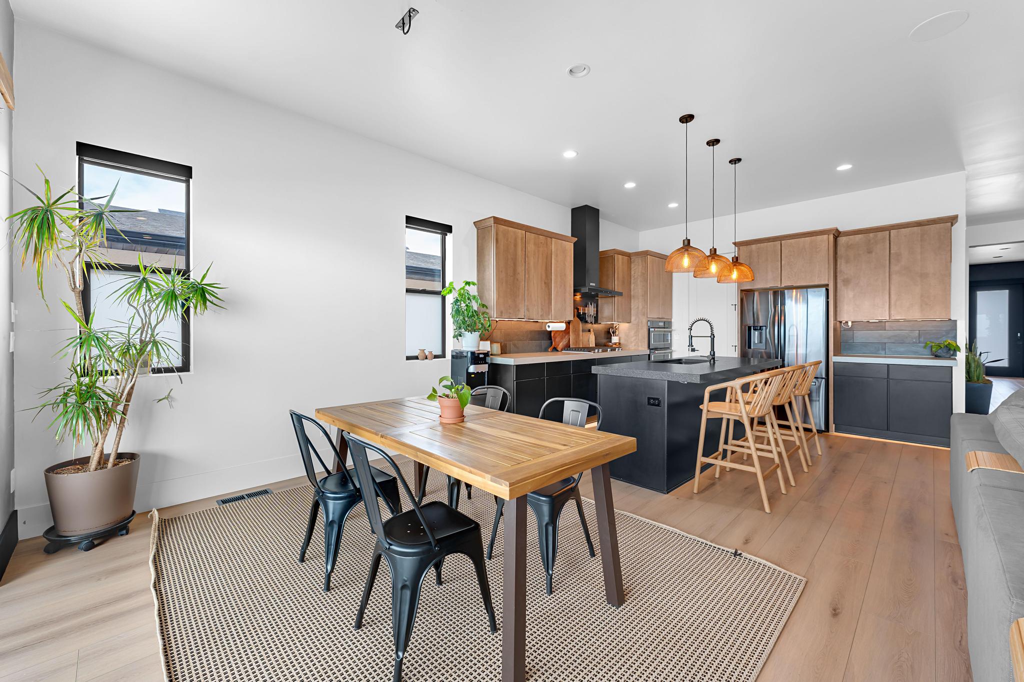 Open-concept living space with light wood-finish flooring