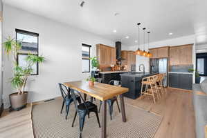 Open-concept living space with light wood-finish flooring