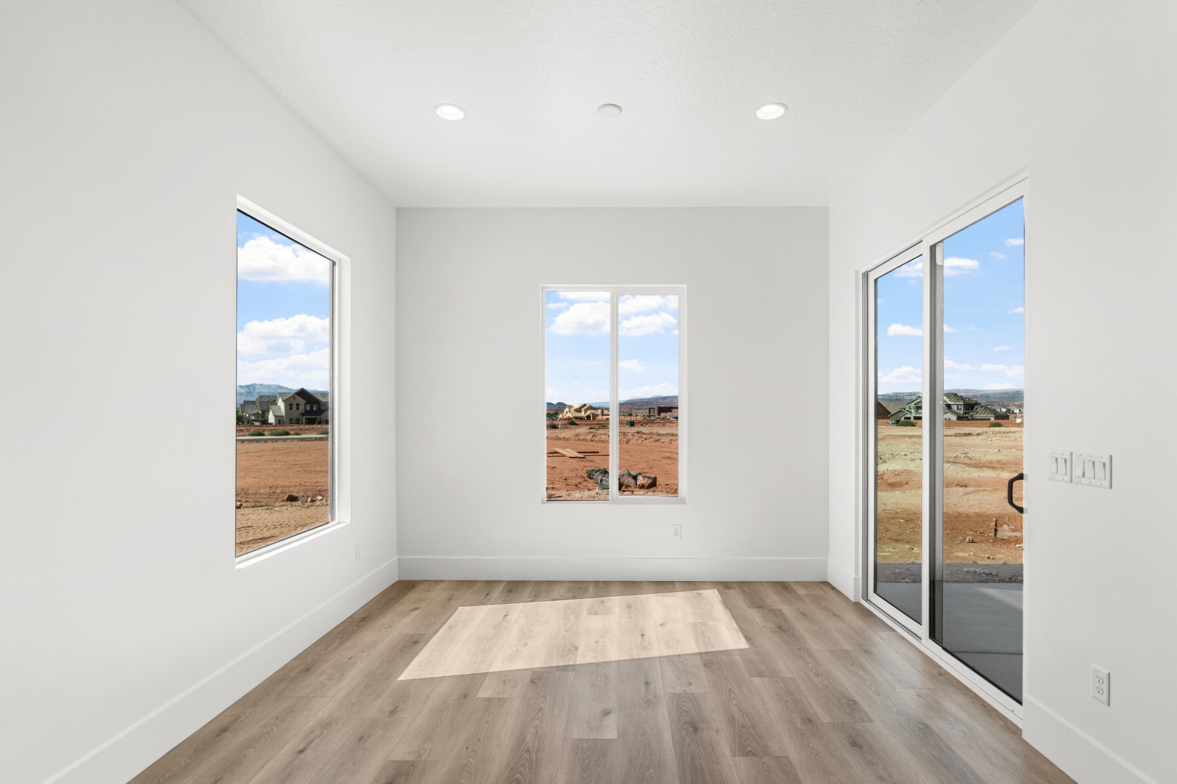 Bright interior space featuring light wood-finish flooring
