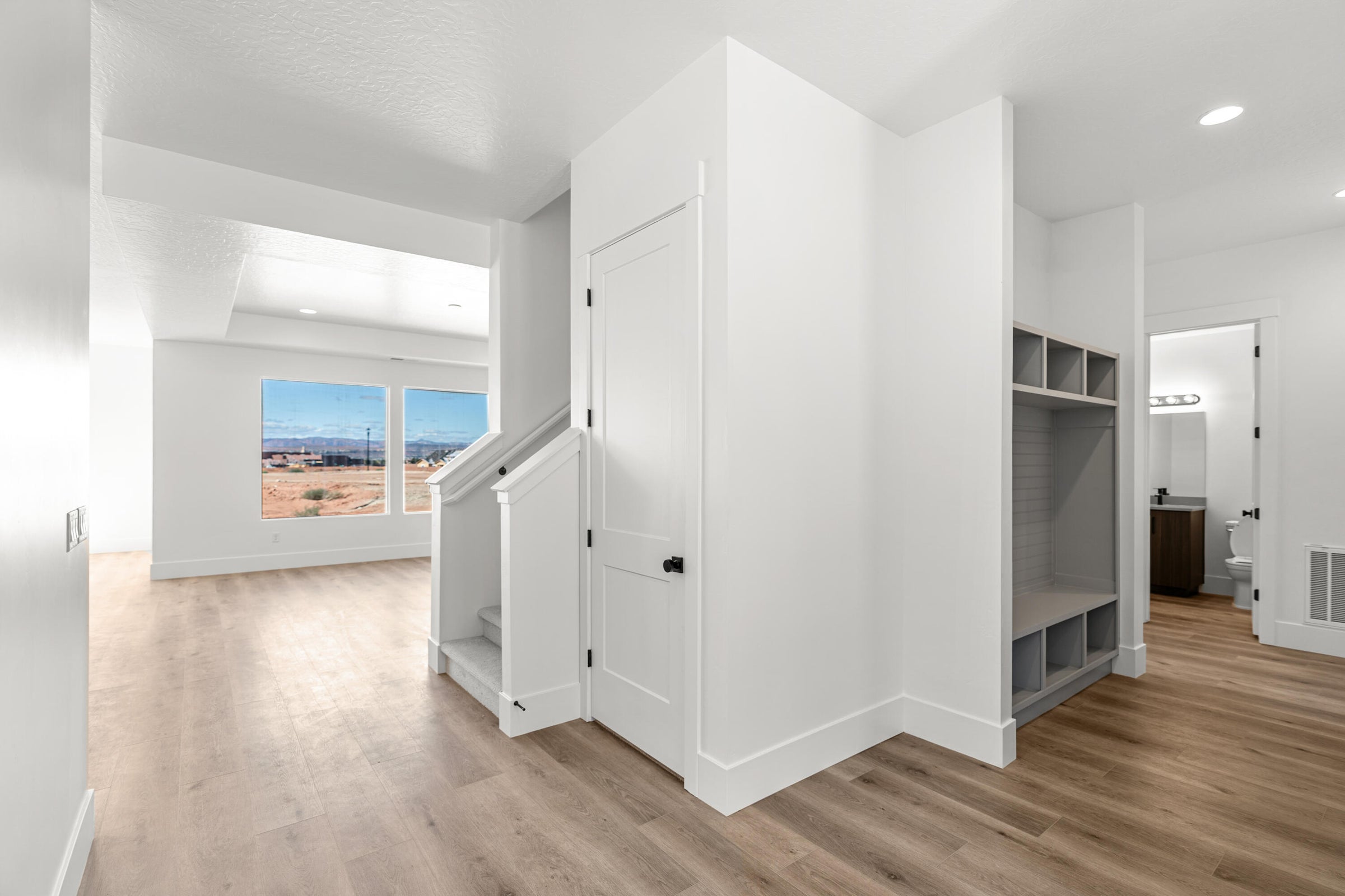 Open concept interior featuring wide plank wood-finish flooring throughout