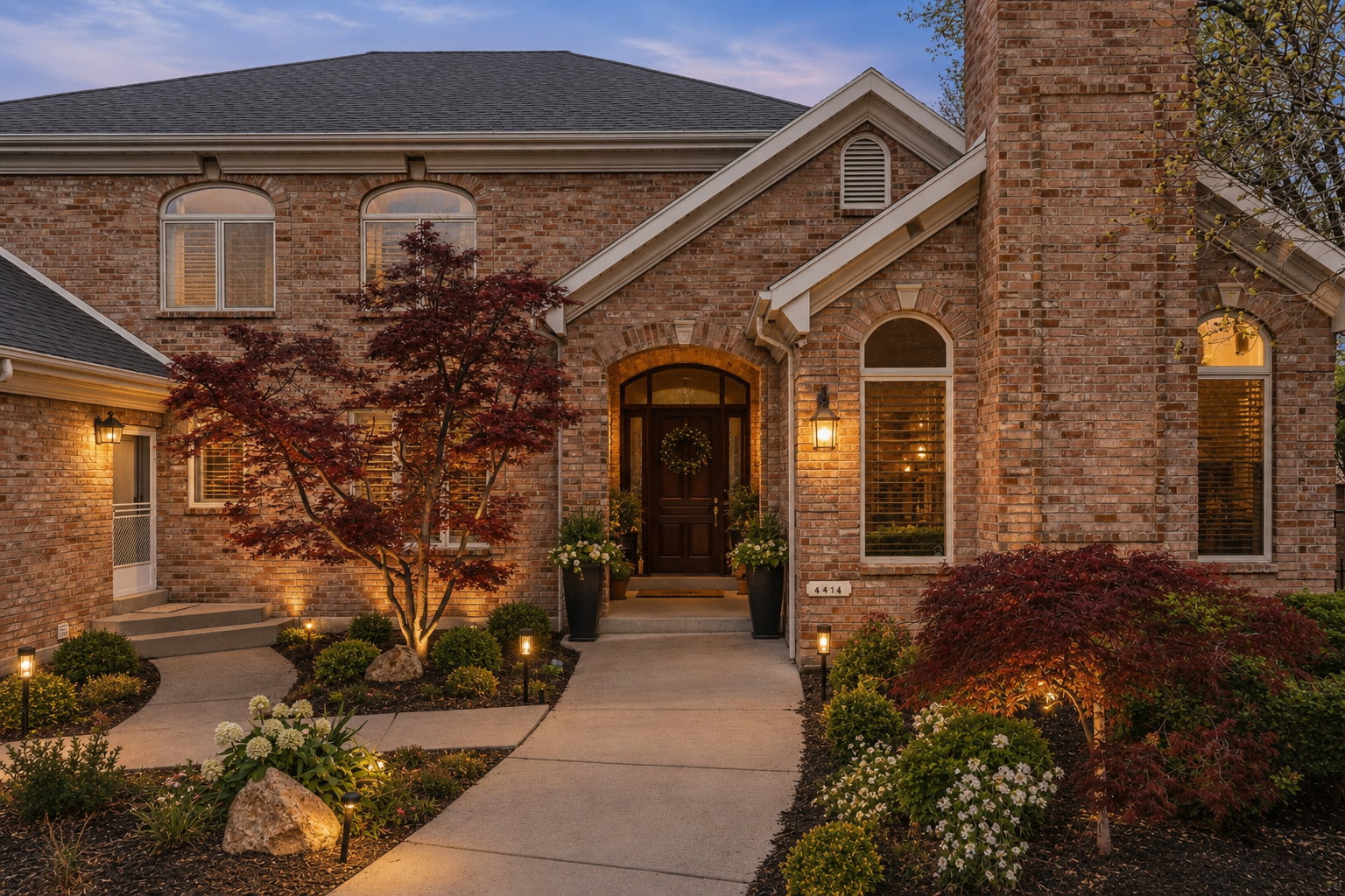 Brick exterior facade featuring architectural arched windows
