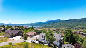 Expansive residential area with mountain and lake scenery