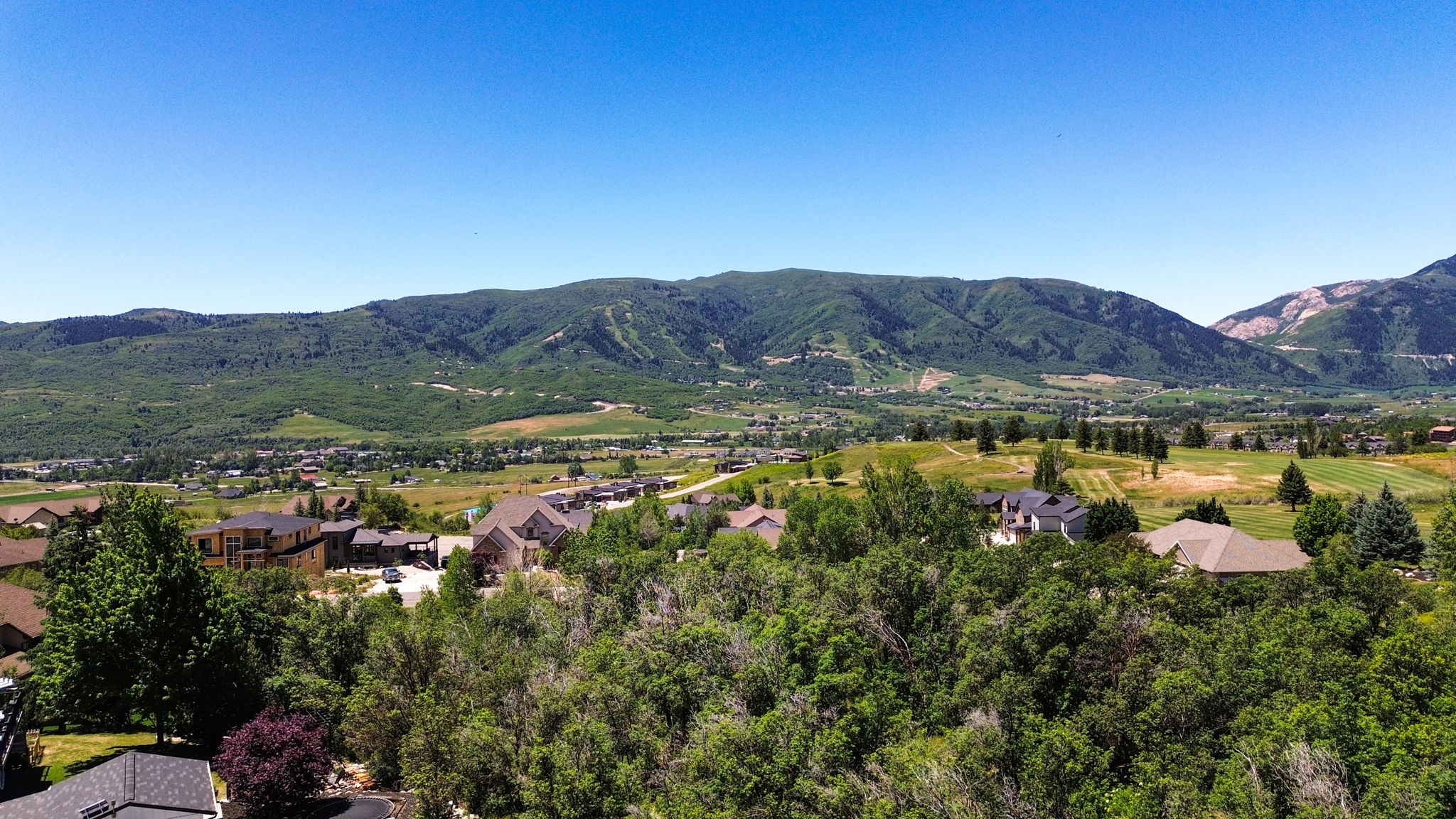 Expansive mountainous terrain with verdant hillsides