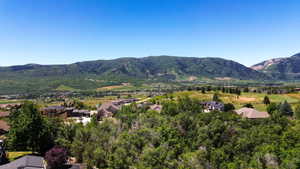 Expansive mountainous terrain with verdant hillsides