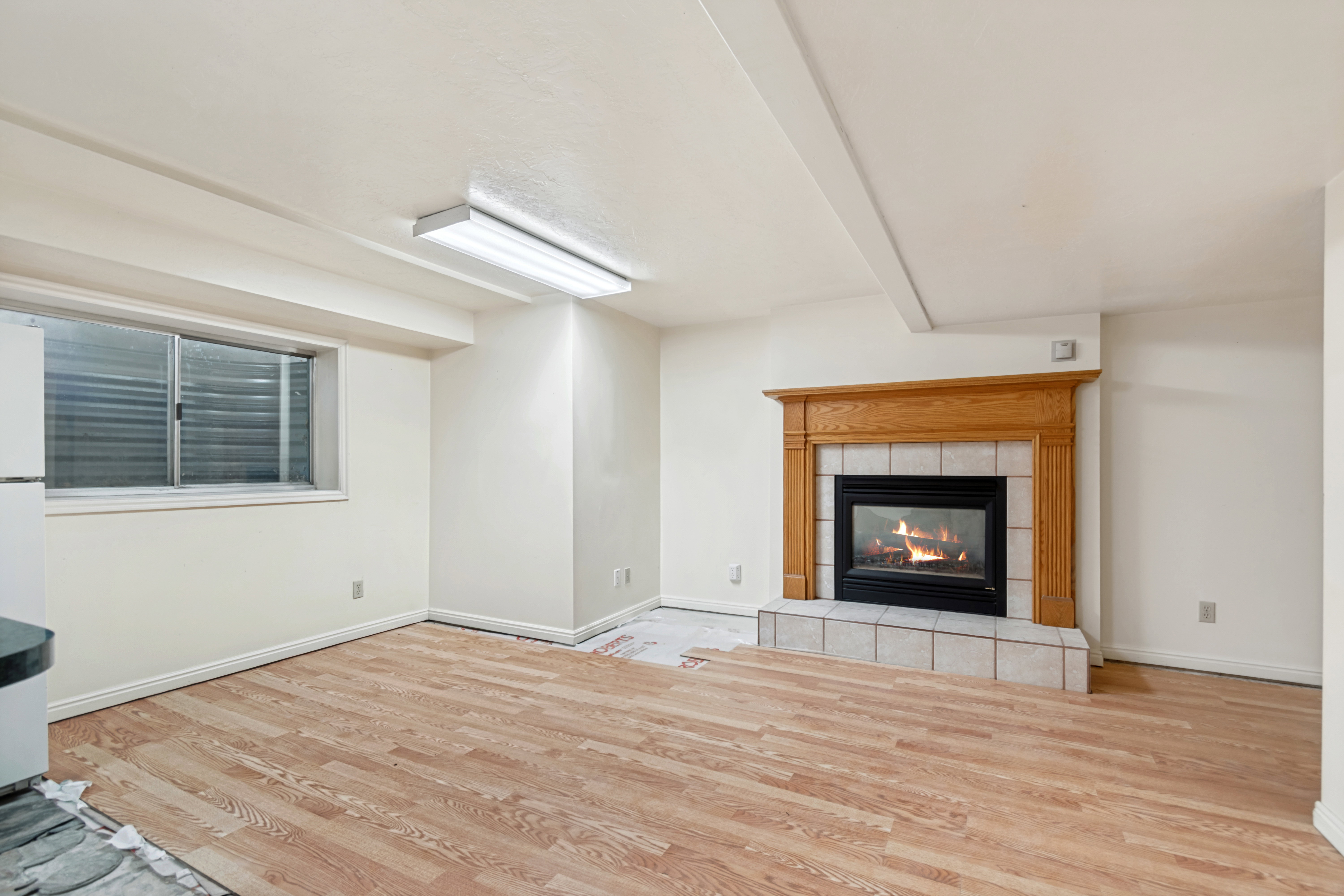 Wood-finish flooring throughout the room