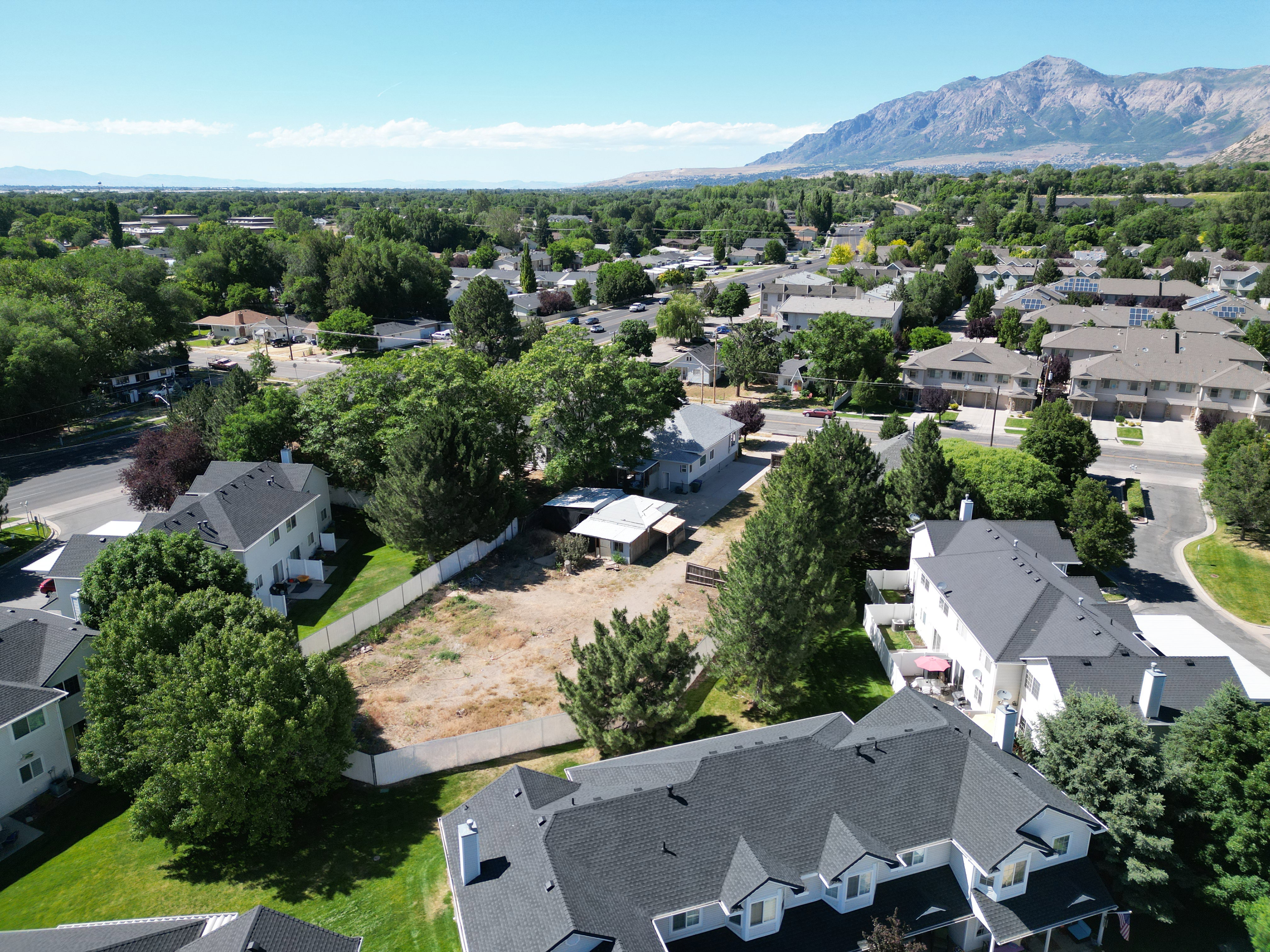 Expansive lot featuring mature trees and a clear building area