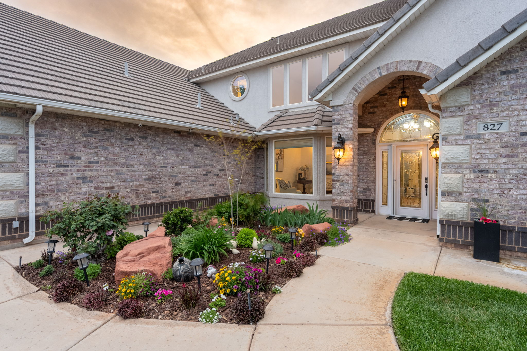 Brick and stucco exterior with an arched entryway
