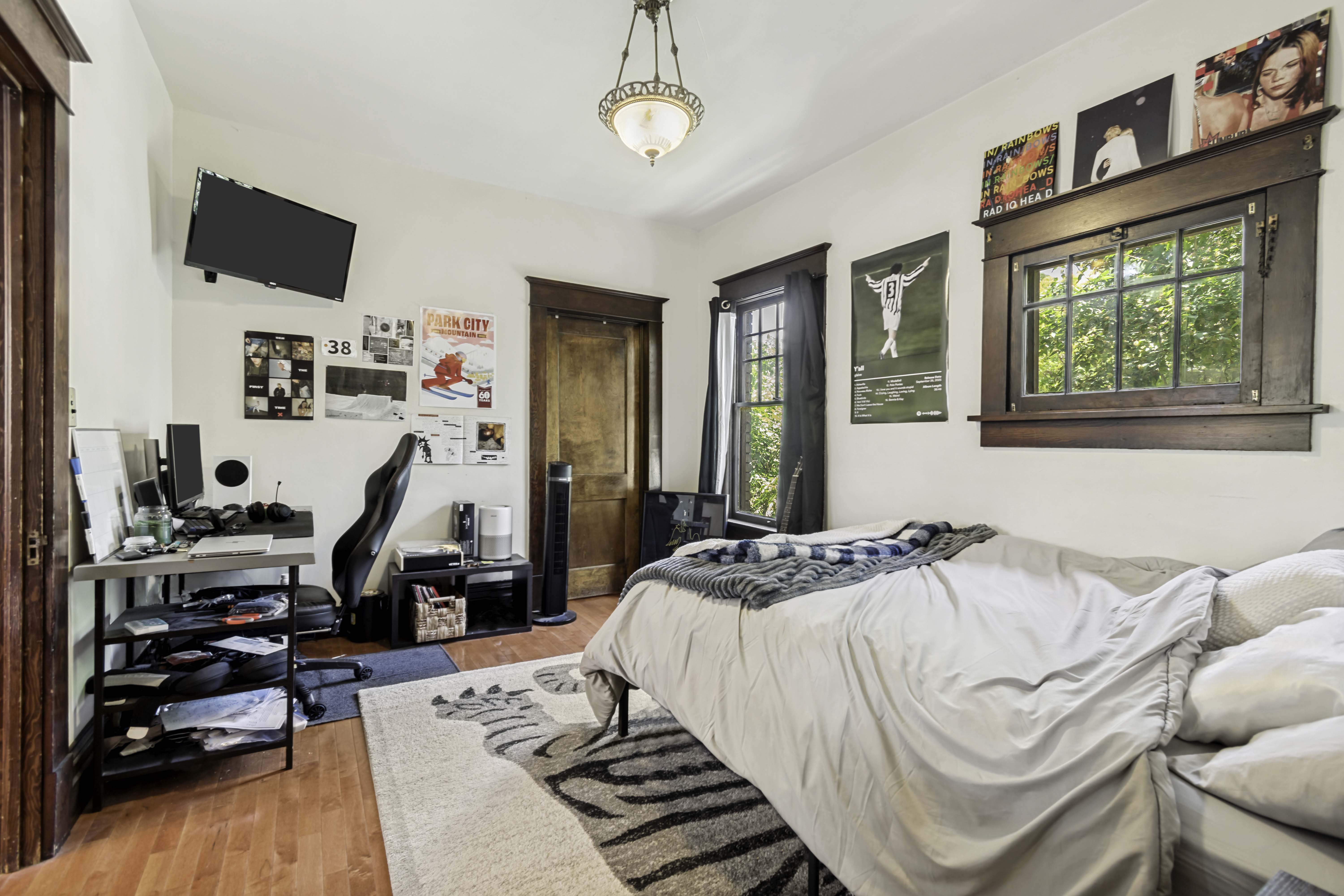 Warm wood-finish flooring complements the white walls