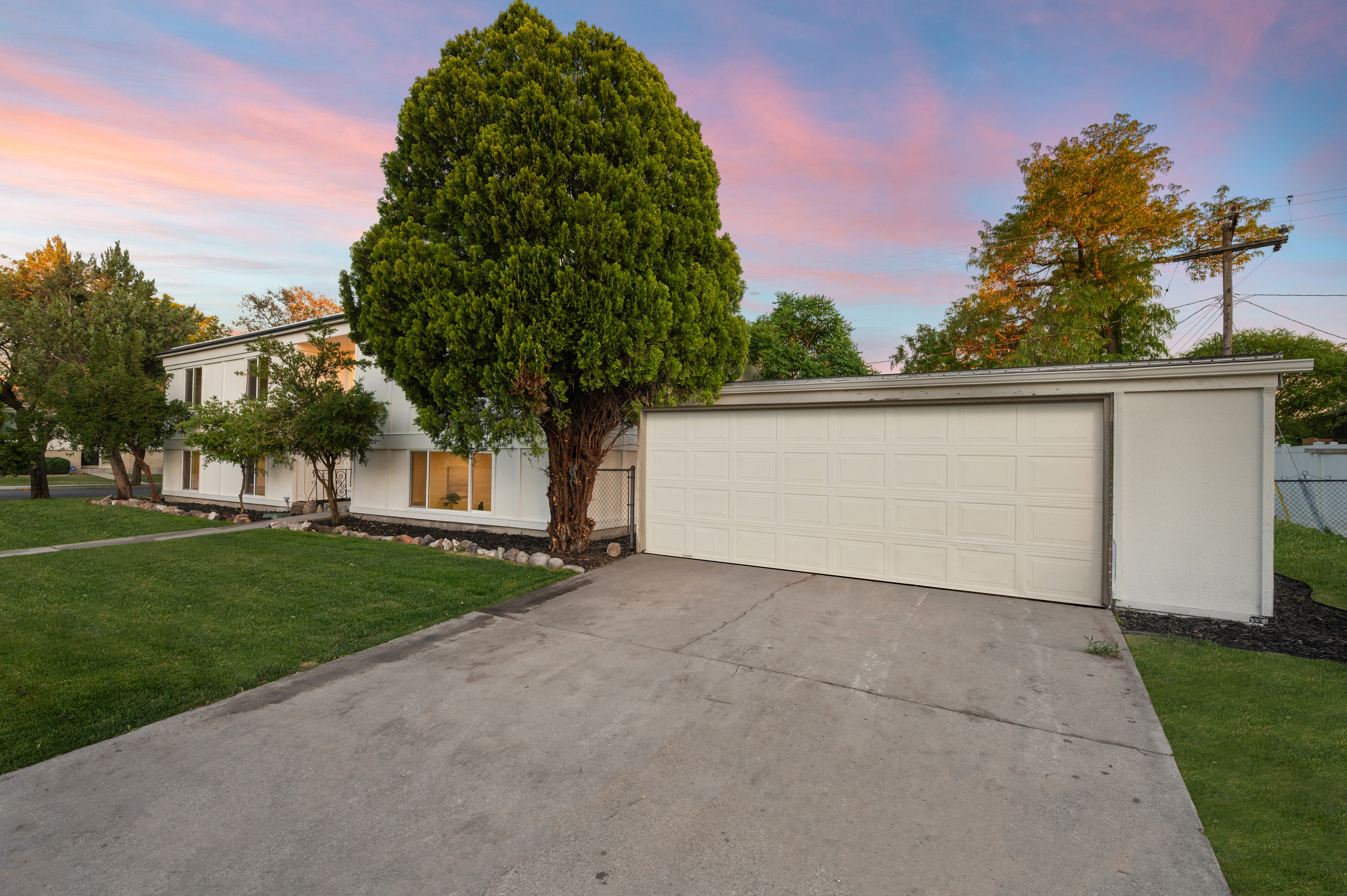 Front exterior with a concrete driveway and an attached two-car garage
