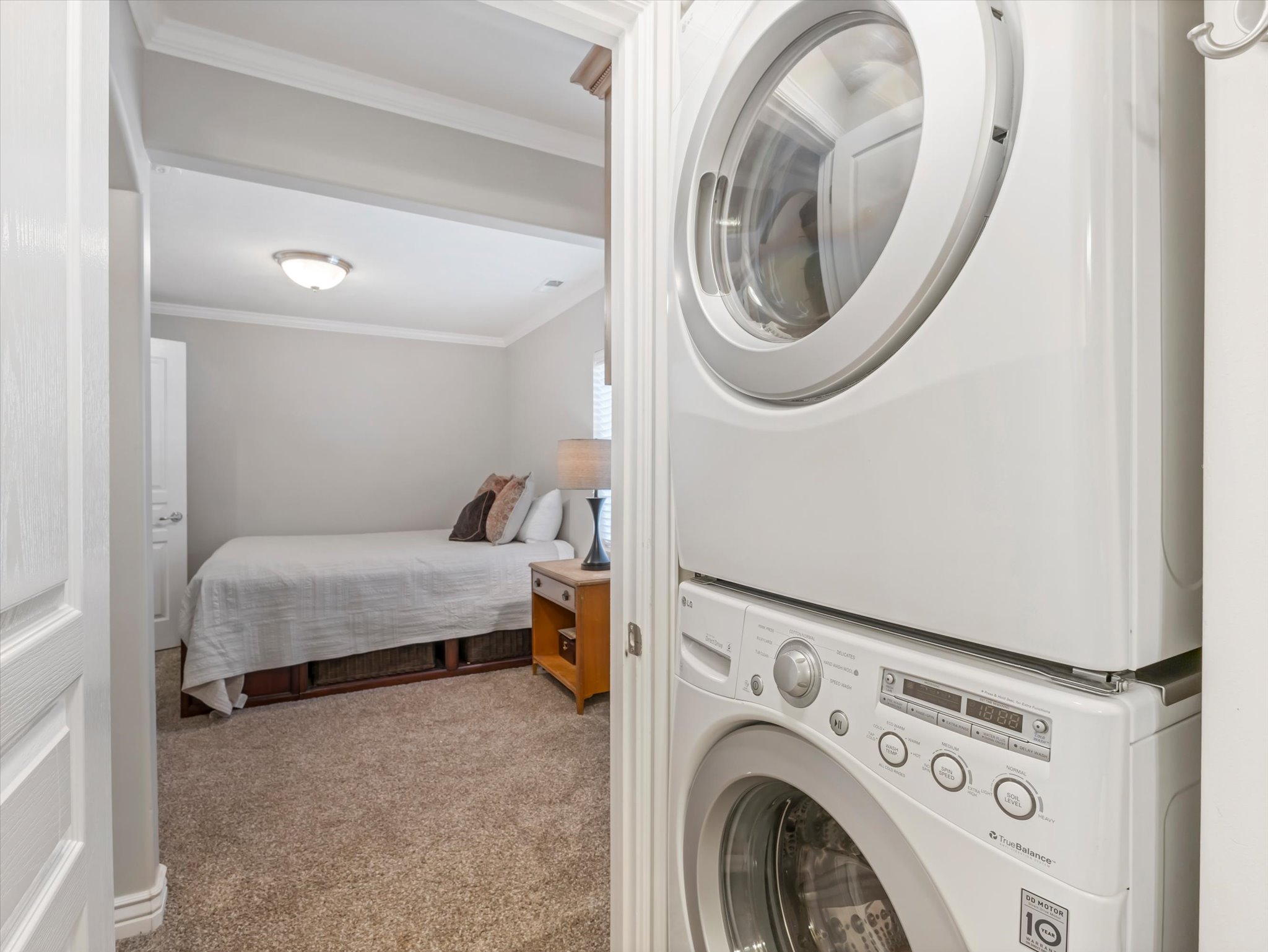 Basement bedroom with attached bathroom/laundry room