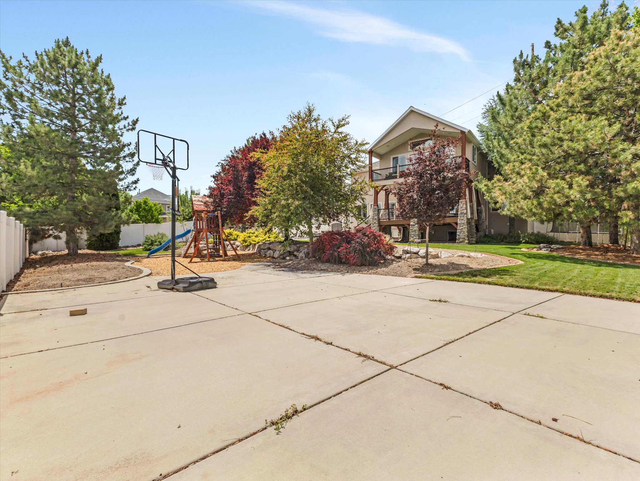 Expansive concrete RV pad paving with a basketball hoop