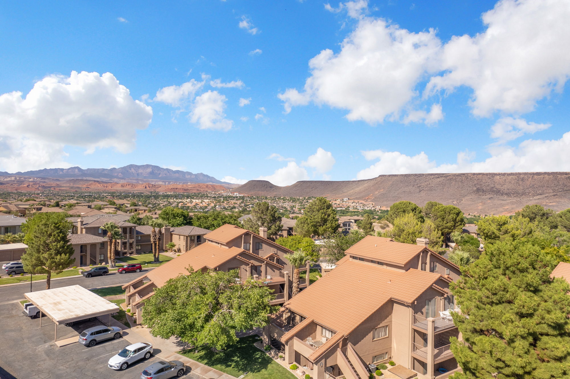 Residences featuring multi-story designs, balconies, and terracotta-style roofing