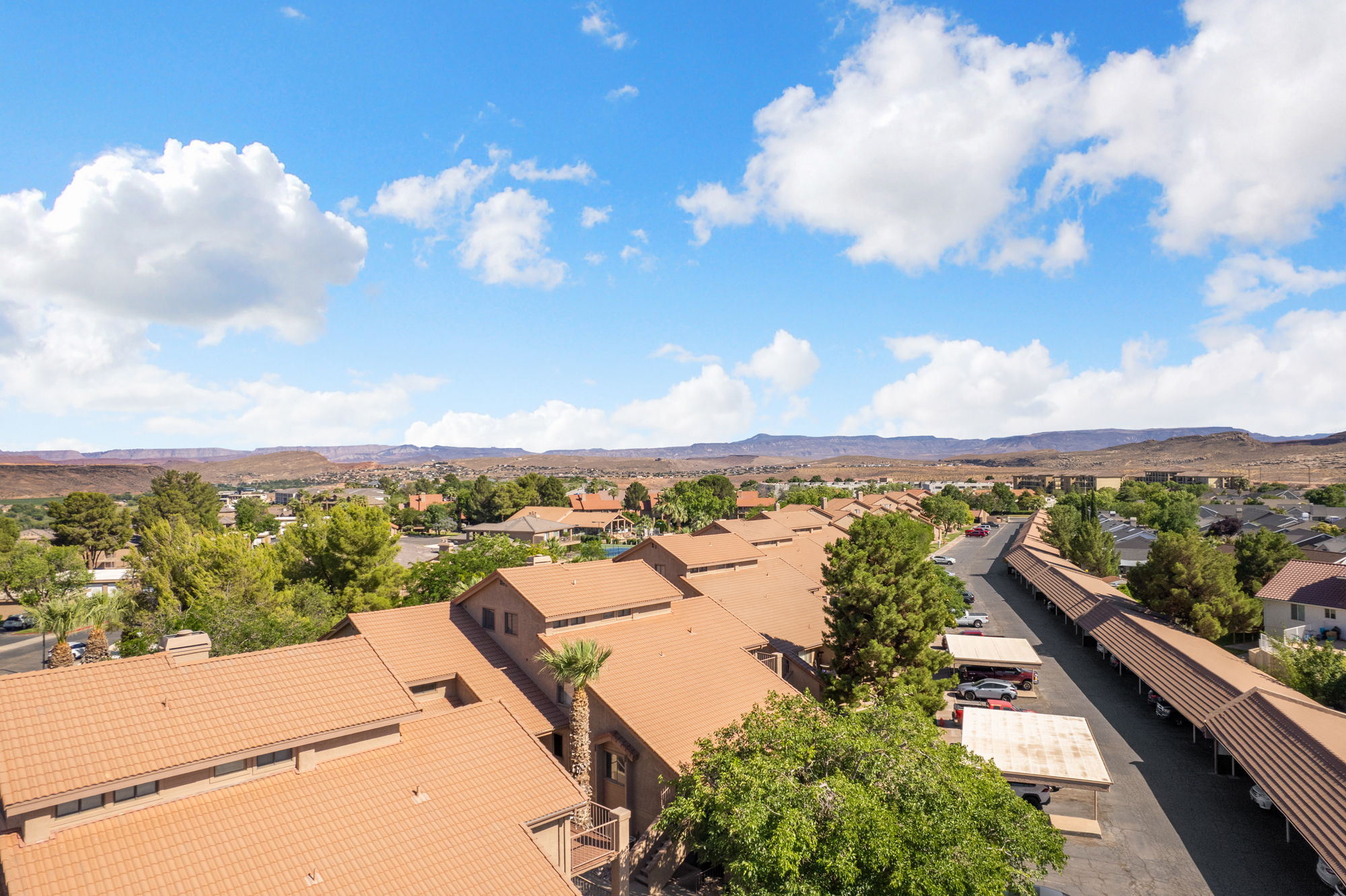 Residential community featuring tile roofs and covered parking