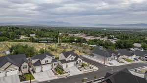 Newly constructed residential area featuring modern homes with dark shingled roofs and light-toned siding