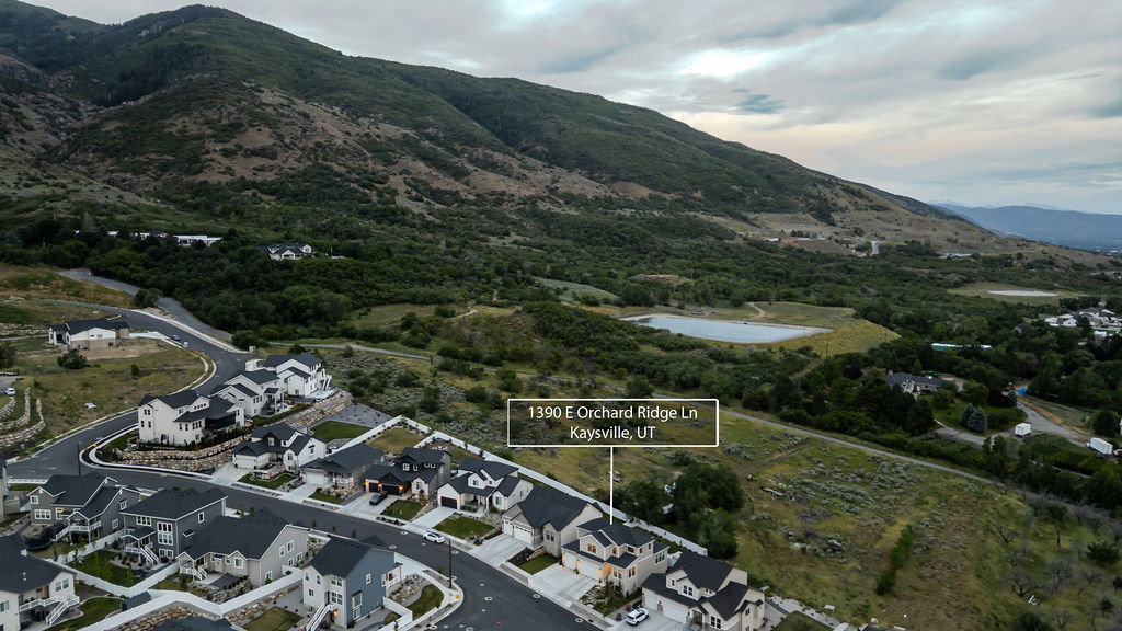 Aerial perspective highlighting a residential development with mountain backdrop