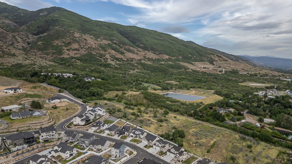 Aerial perspective highlighting a residential development with a mountainous backdrop