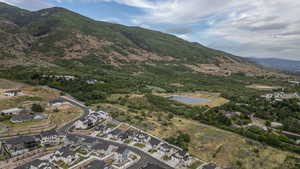 Aerial perspective highlighting a residential development with a mountainous backdrop