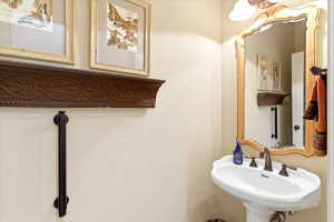 Pedestal sink with a three-piece bronze faucet set