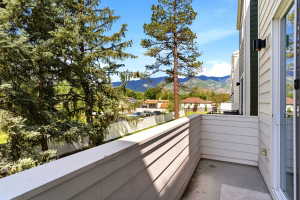 Private balcony featuring horizontal siding and a full glass sliding door