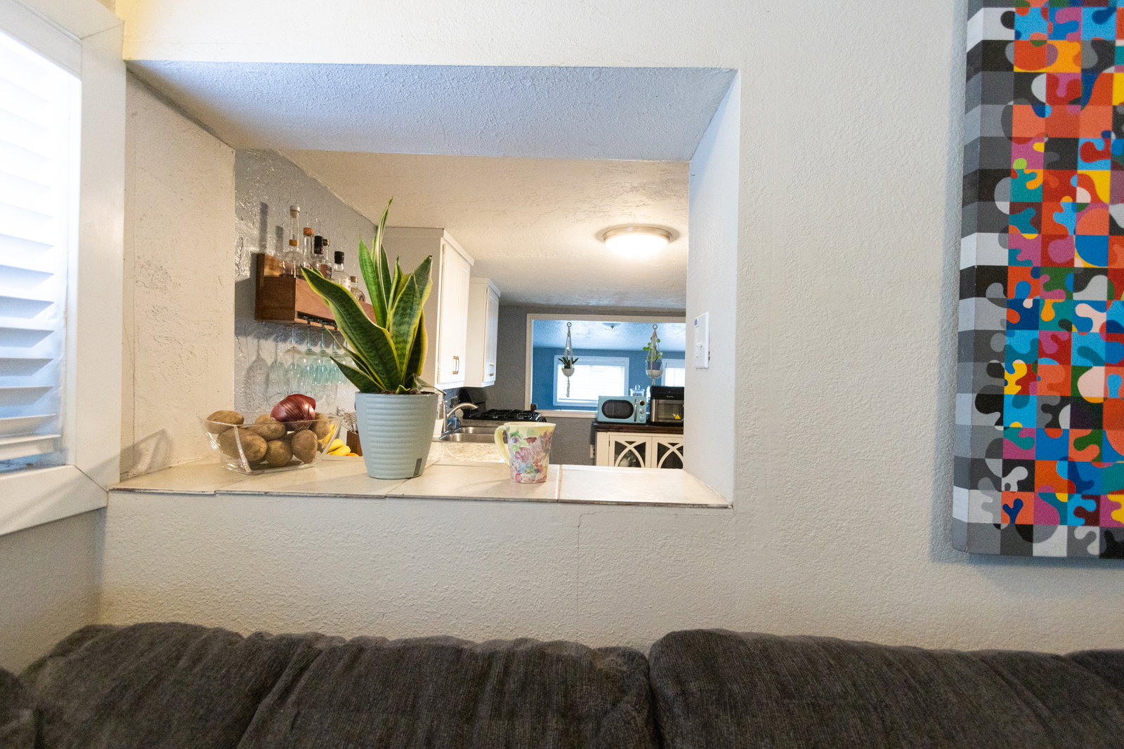 Kitchen pass-through window with a tiled countertop