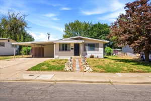 Beautiful updated home with 2-car carport with an attached secure shed.