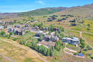 Expansive mountain landscape featuring multiple custom residences and abundant natural terrain