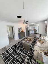 Open concept living area with recessed lighting, ceiling fan, and wood-finish flooring