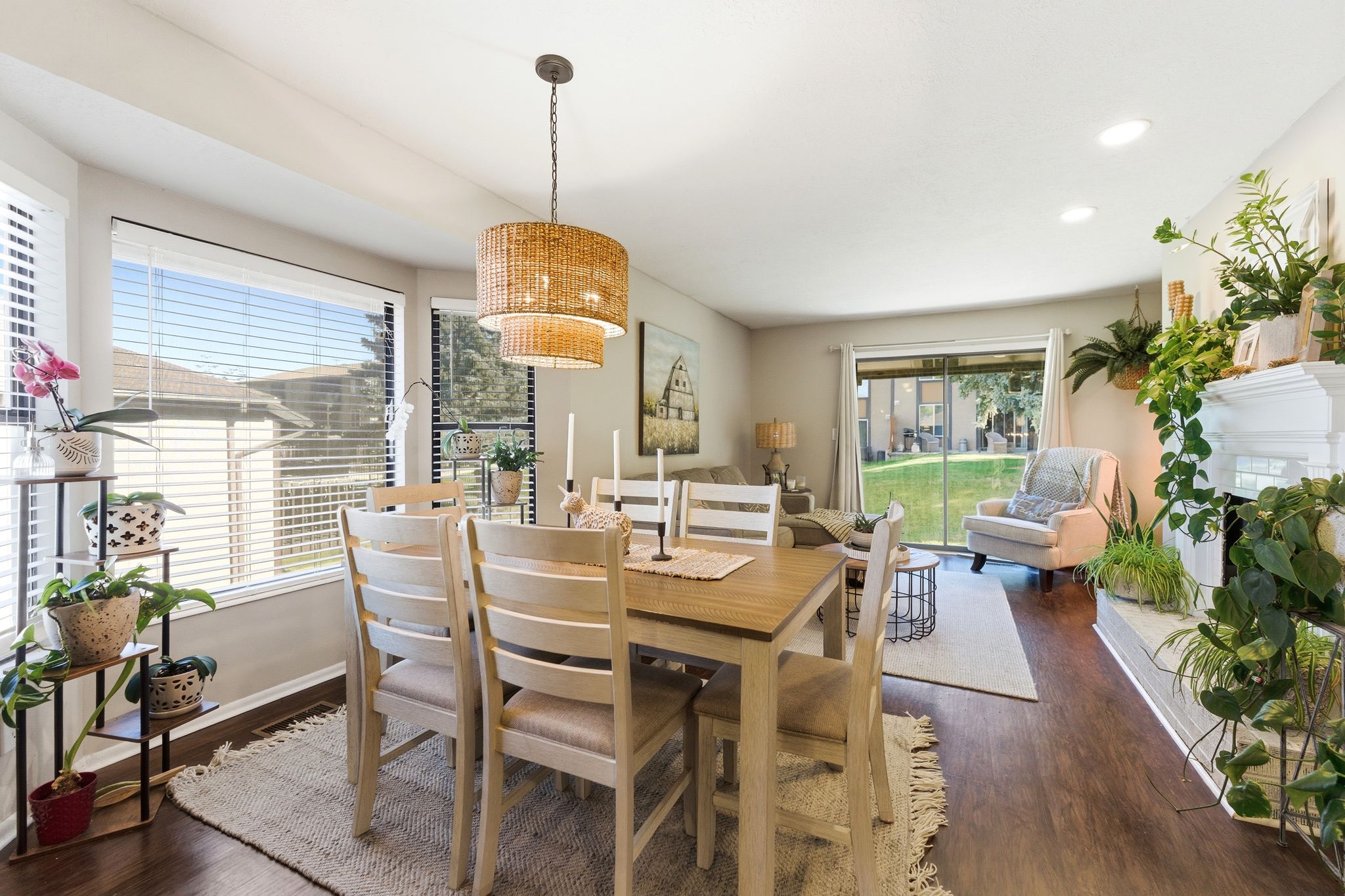 Dining space featuring a tiered woven pendant light fixture