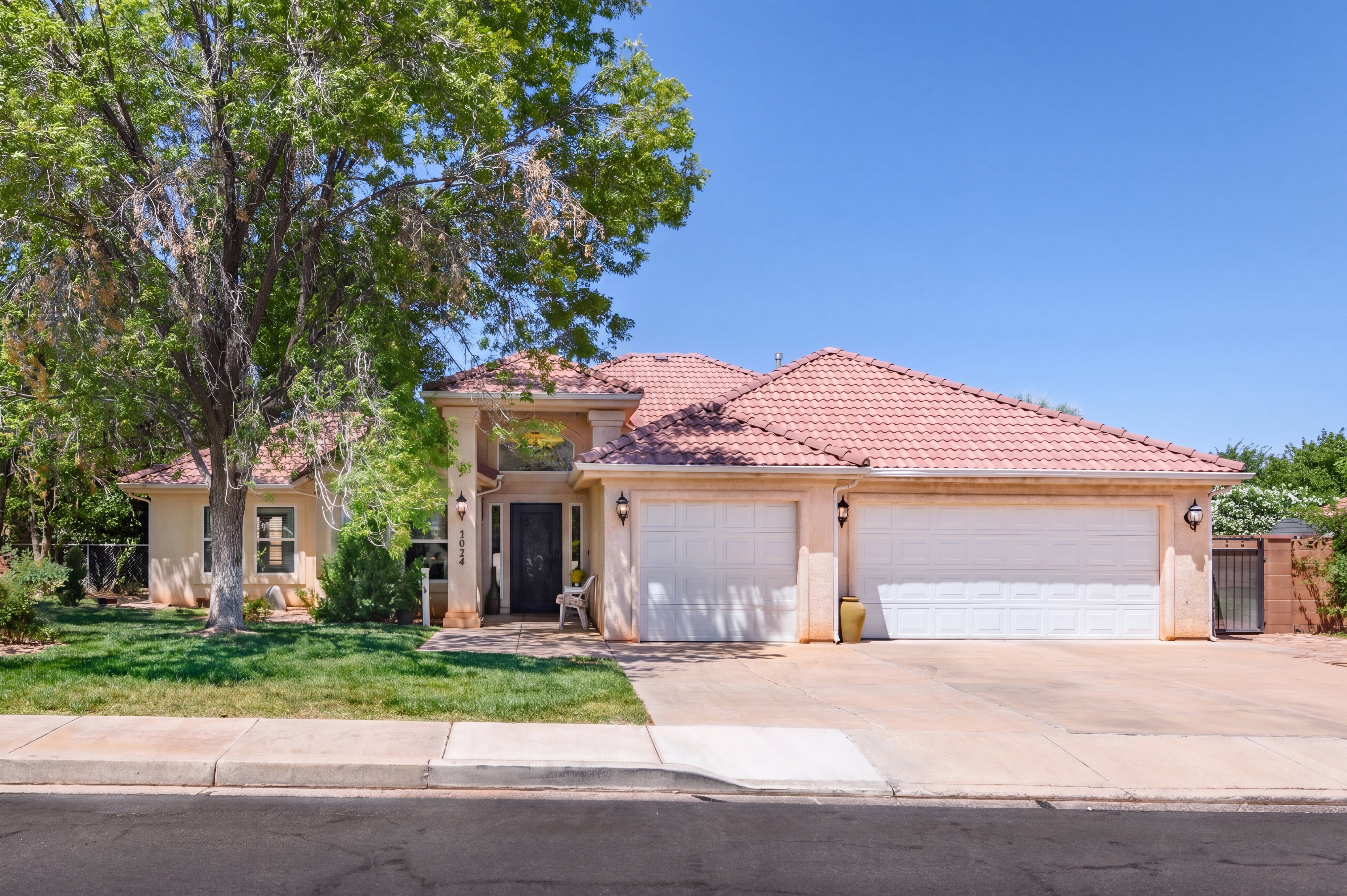 Stucco exterior with a terracotta tile roof