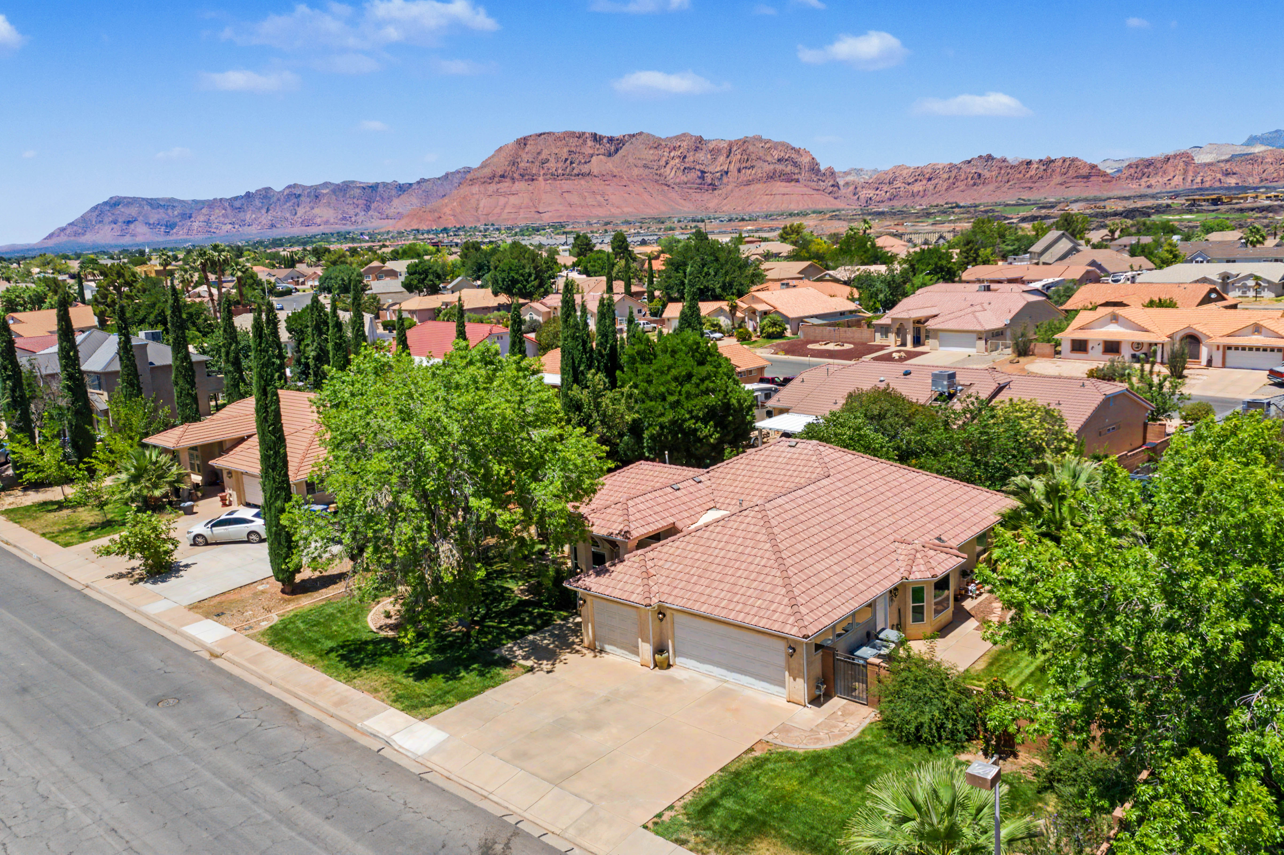 Terracotta tile roof with a two-car garage