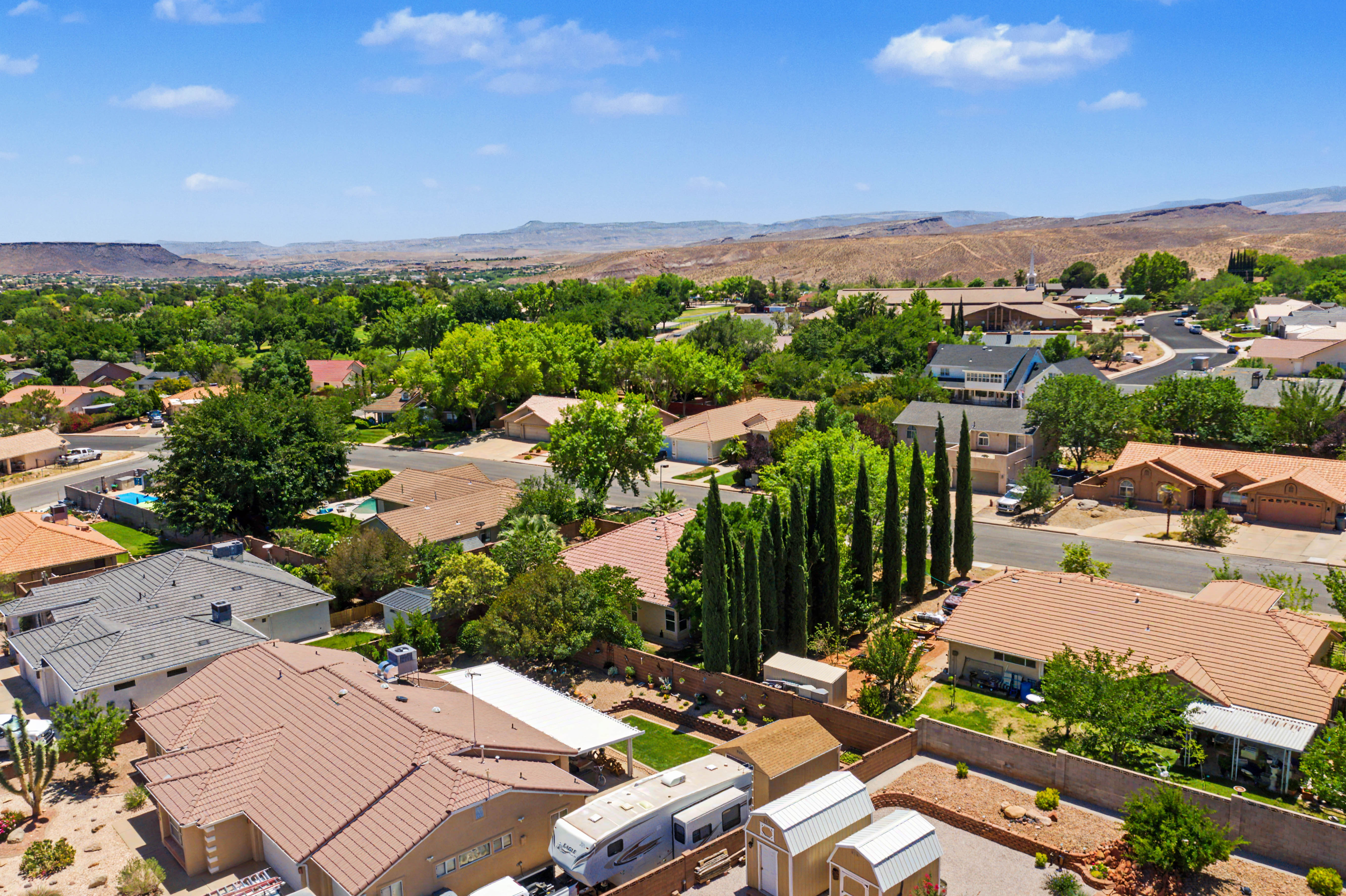 Aerial perspective showcasing a residential neighborhood with varied architectural styles and mature landscaping