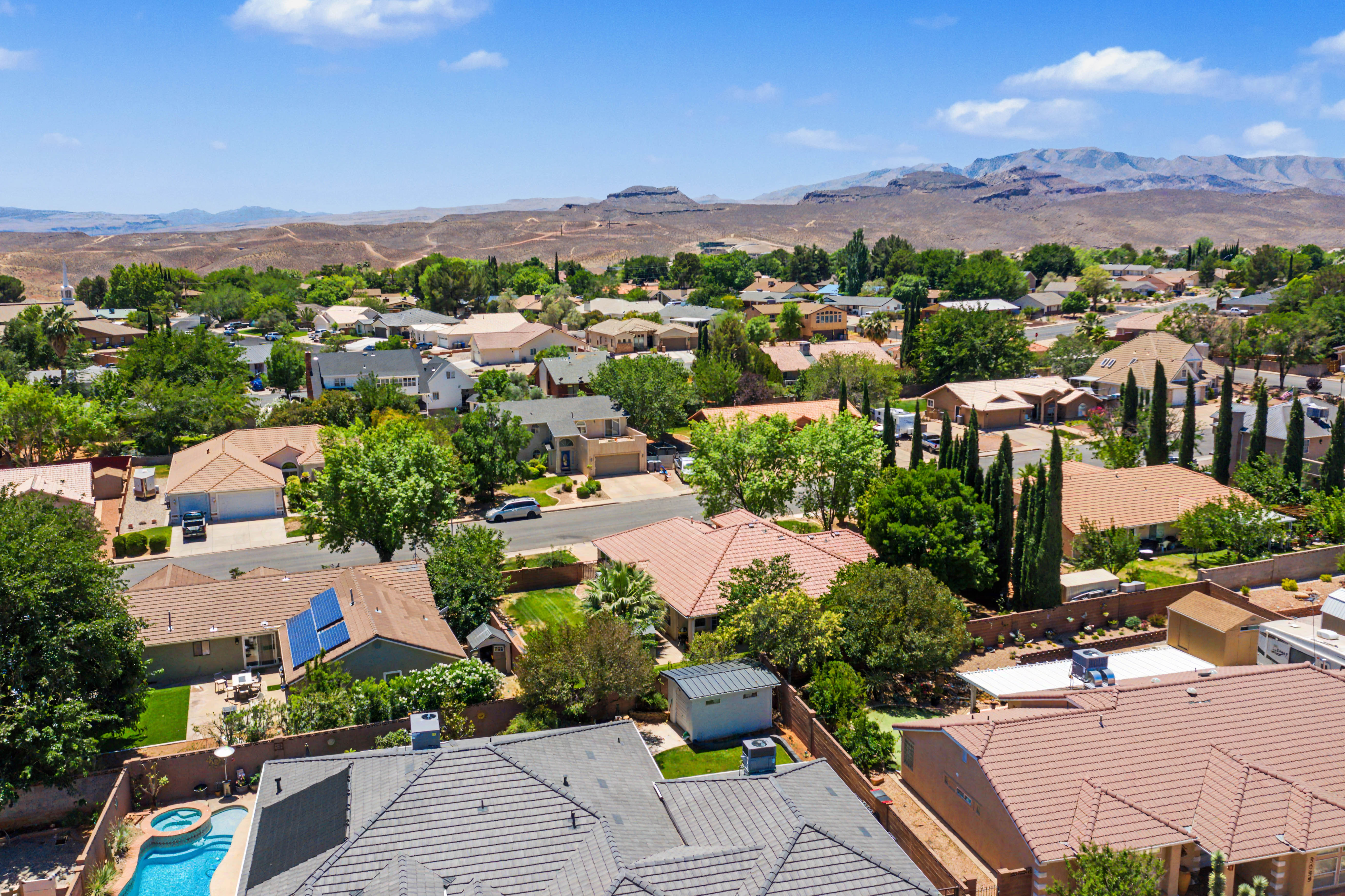 Aerial perspective showcasing a residential neighborhood with varied architectural styles and mature landscaping