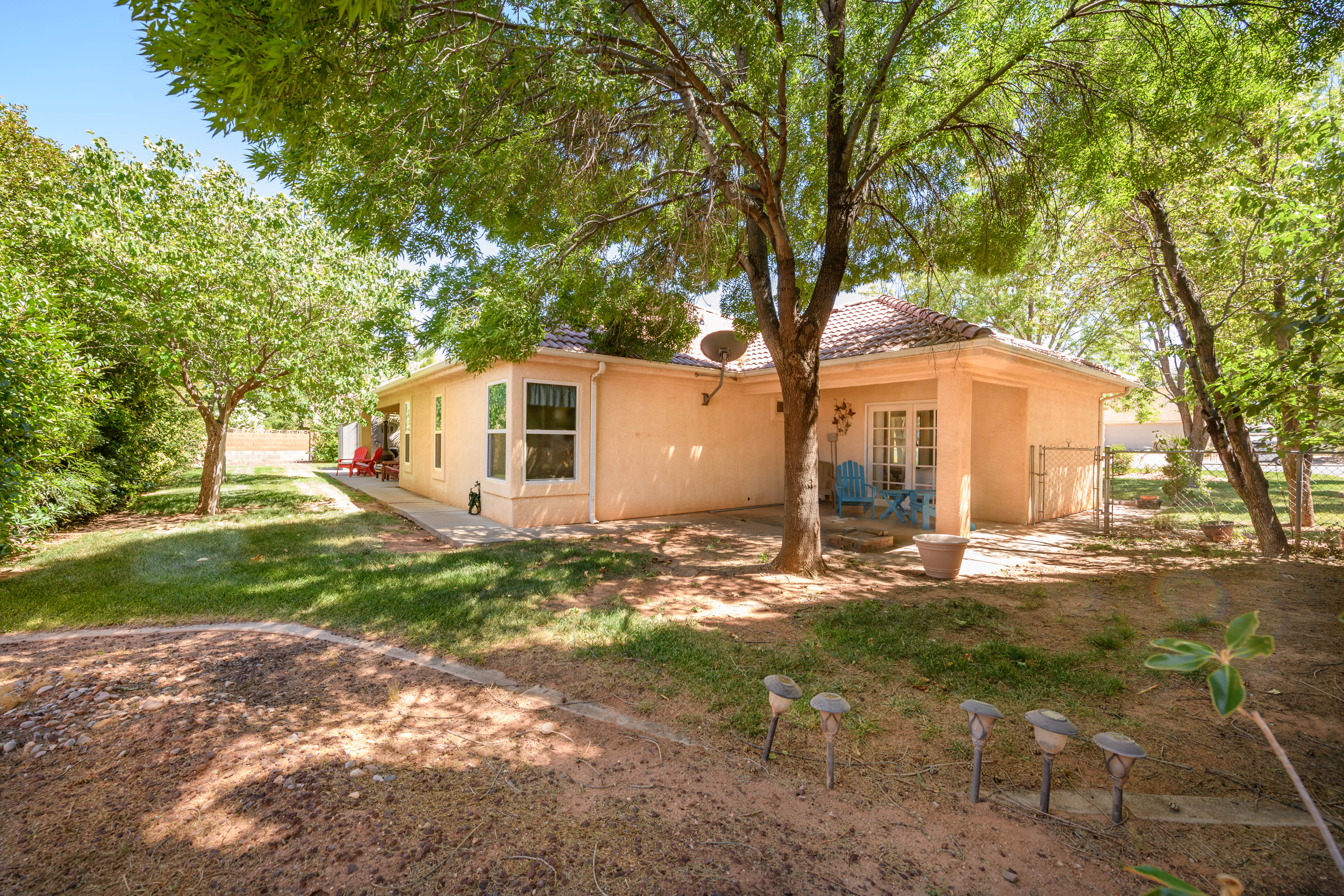 Expansive exterior featuring stucco siding and a tile roof