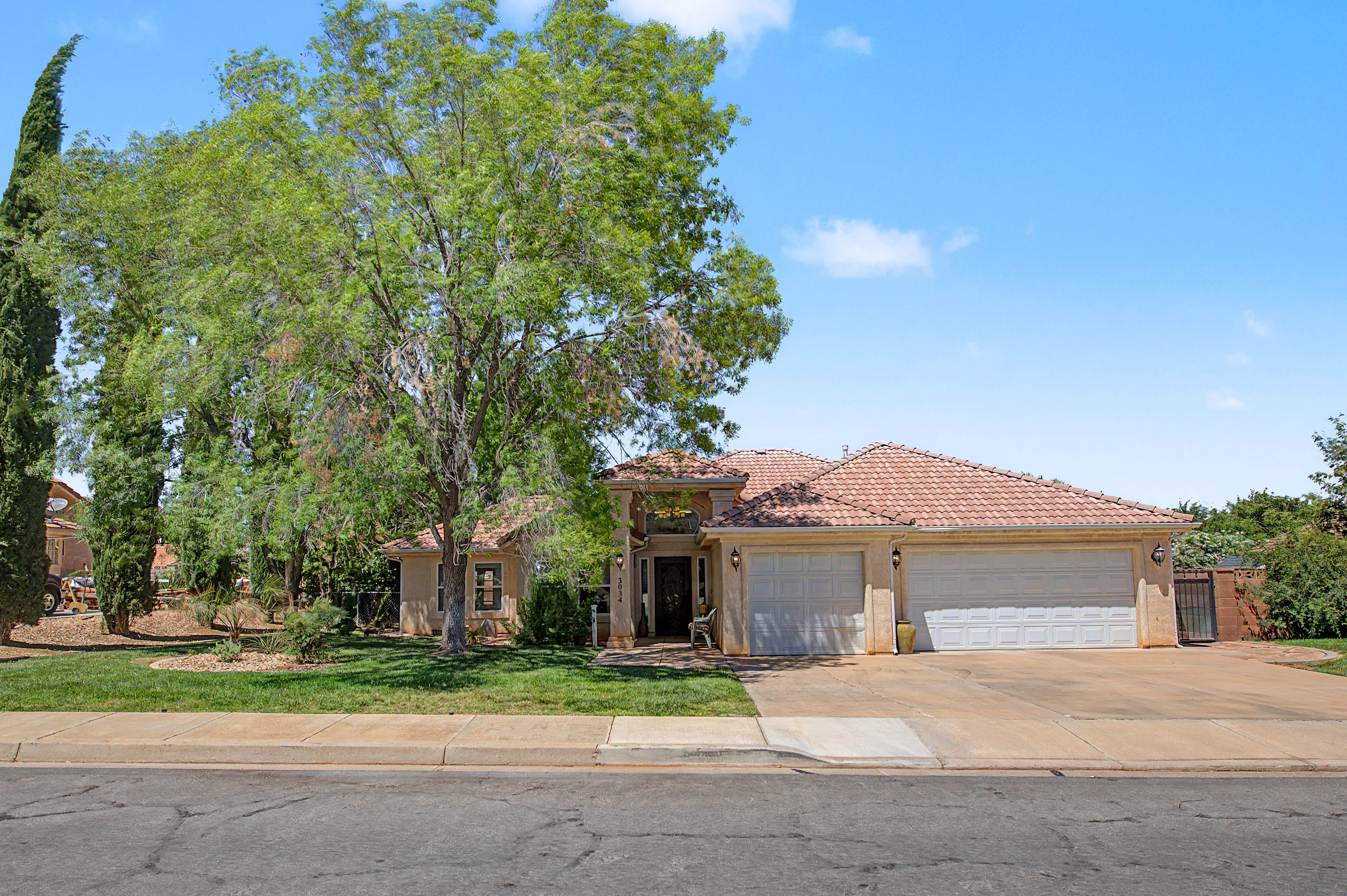 Terracotta tile roof with a three-car garage