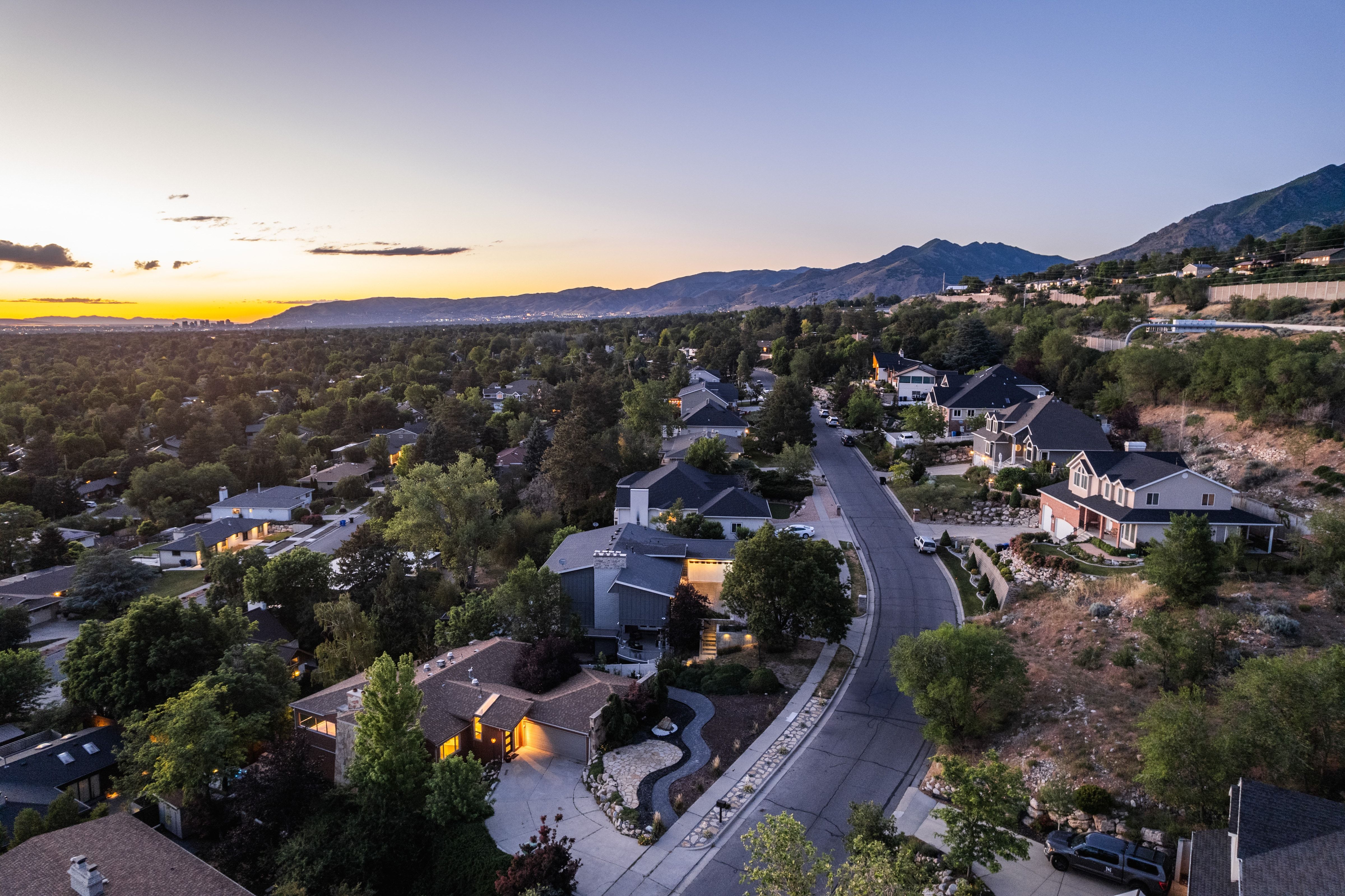 Residential neighborhood featuring varied architectural styles and mature landscaping