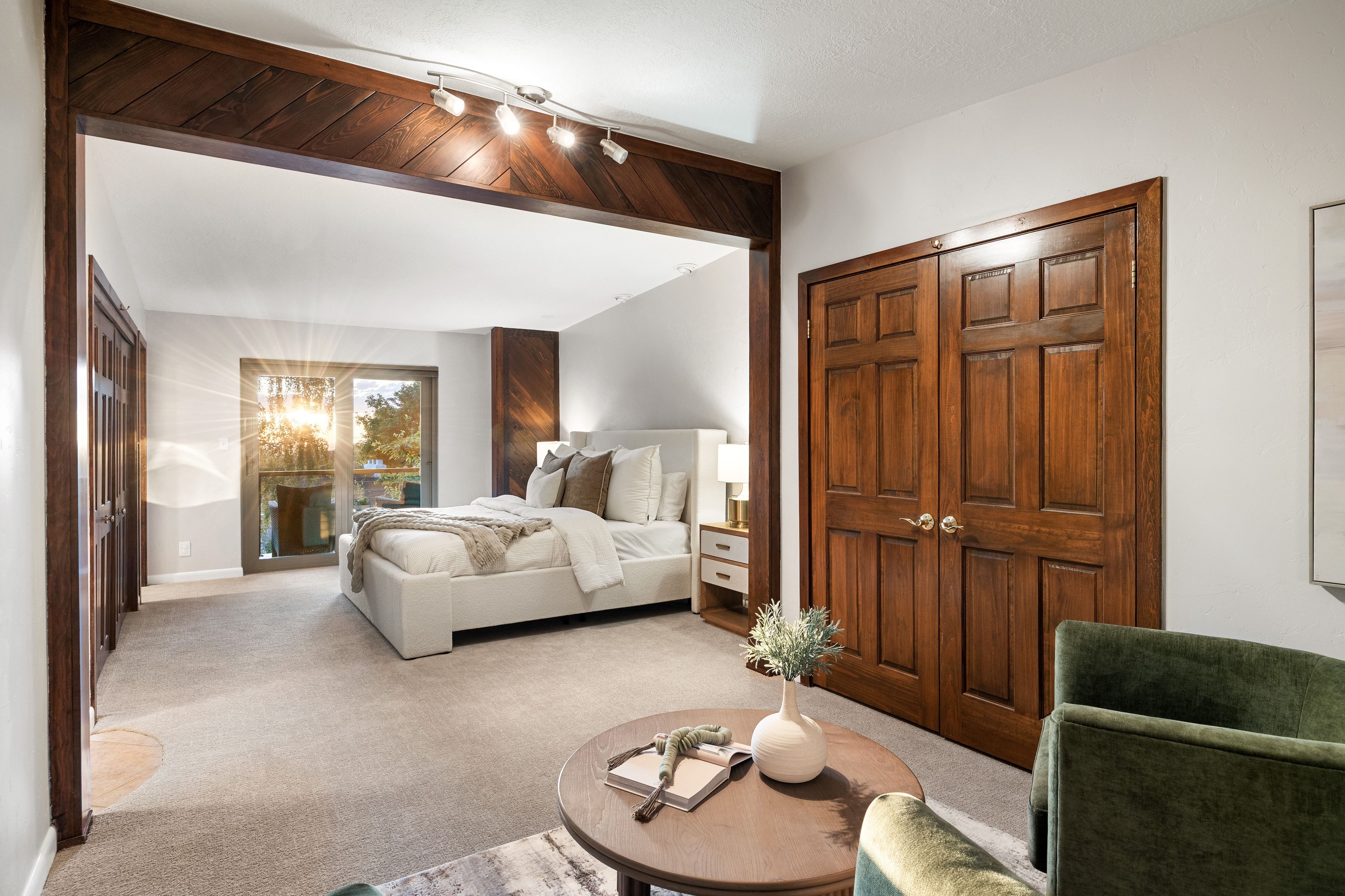 Open concept room featuring a recessed sleeping area with direct outdoor access