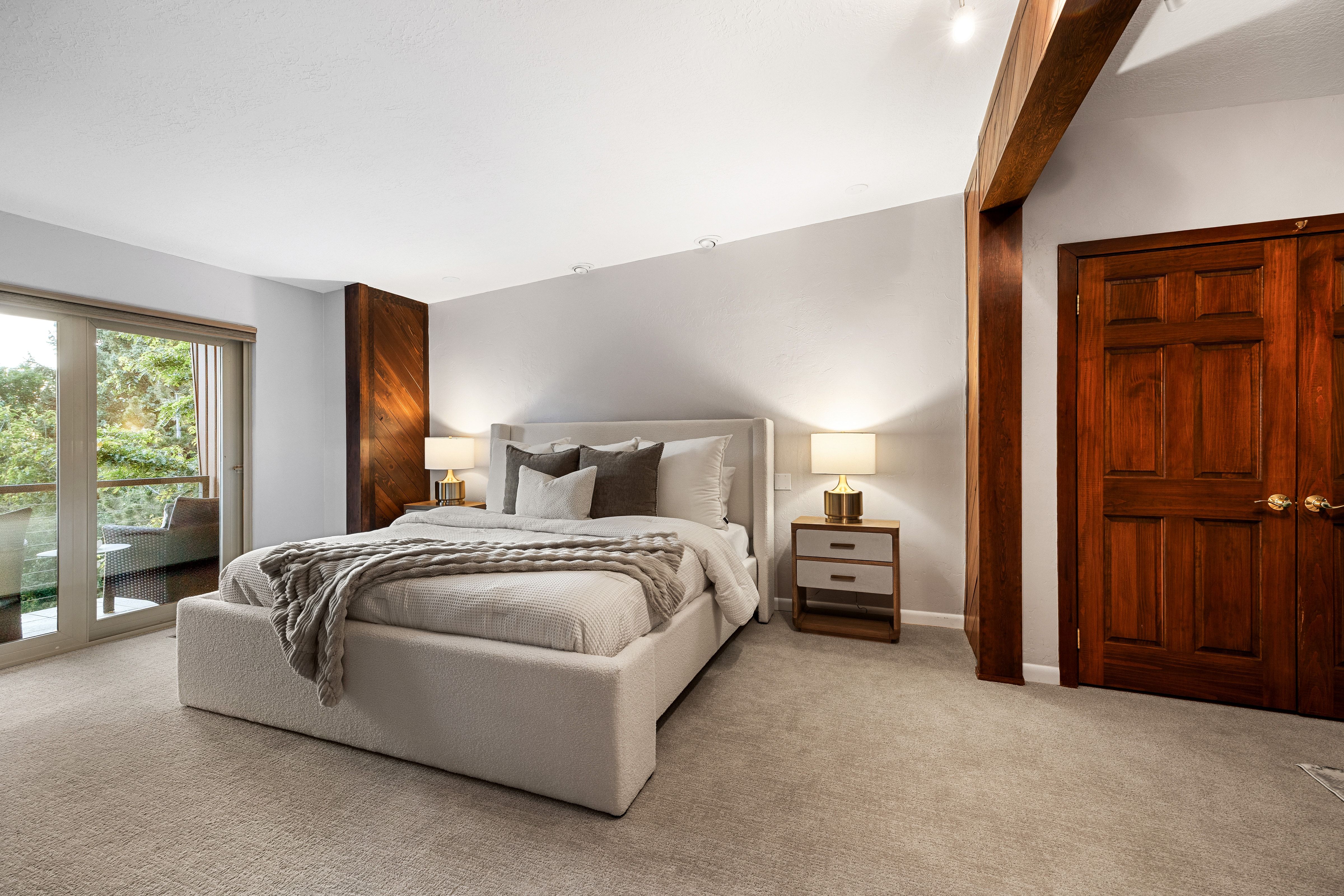 Hardwood-paneled accent wall and exposed beam detailing