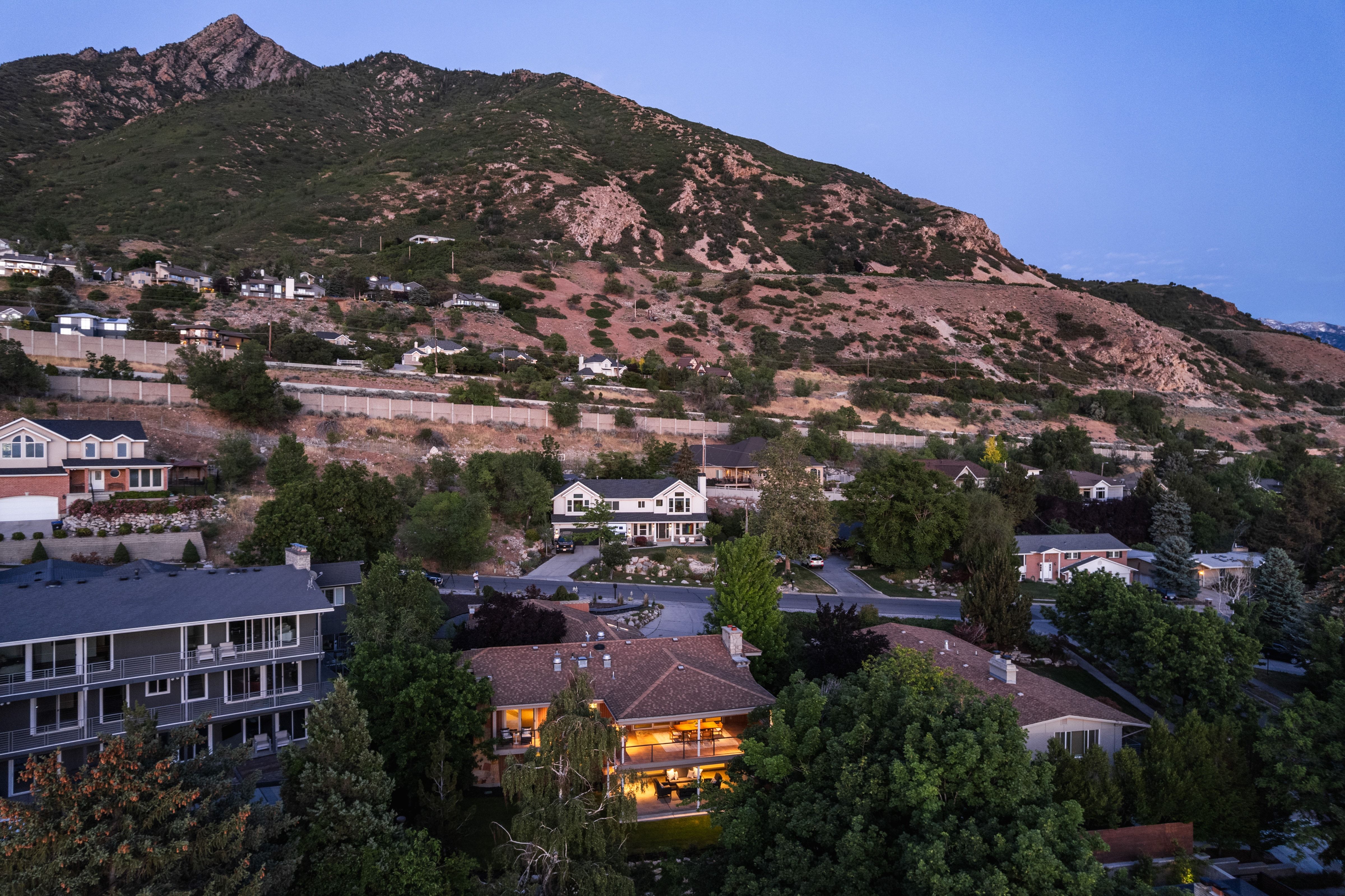 Terraced residential area set against a mountainous backdrop