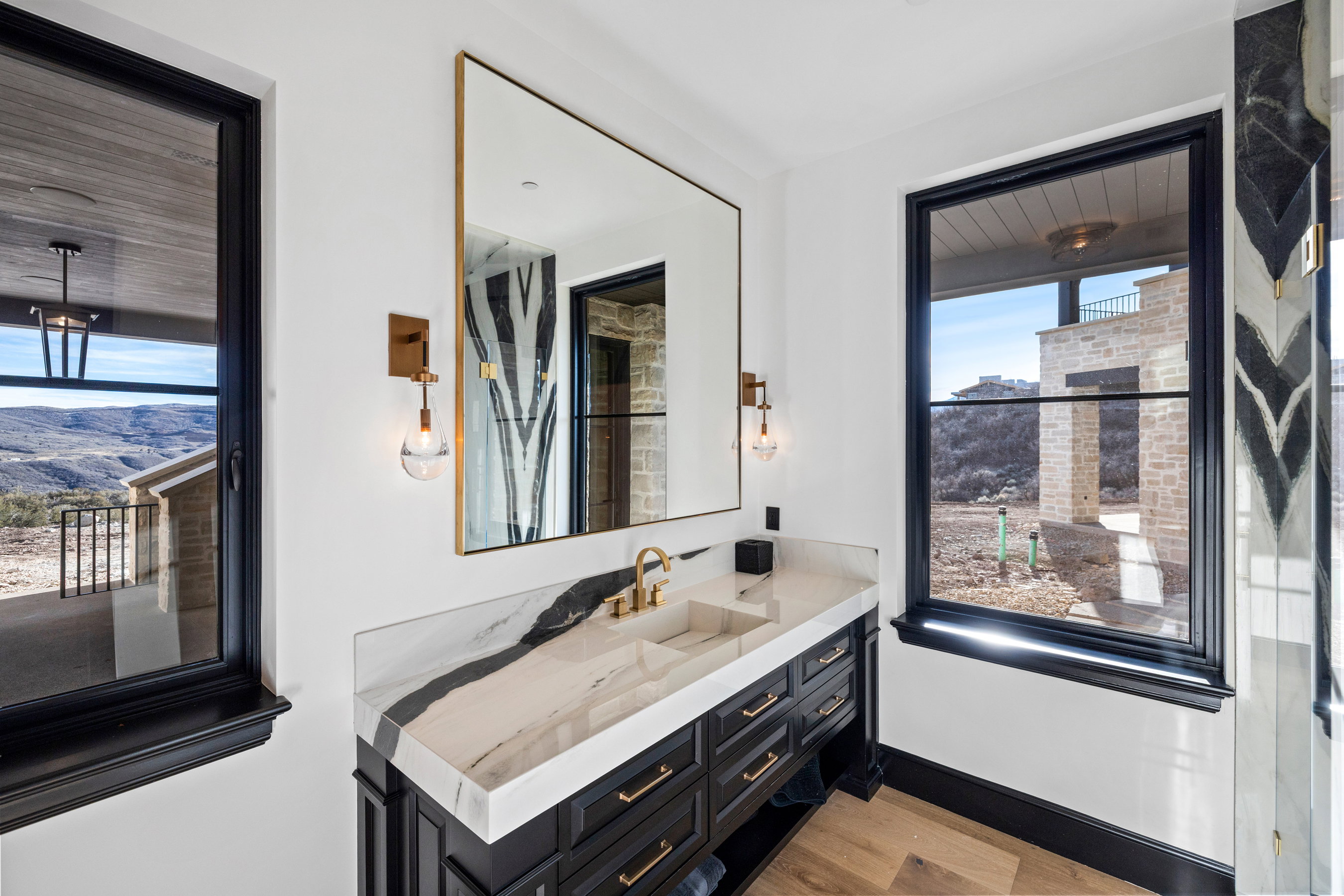 Vanity with integrated rectangular sink and veined countertop