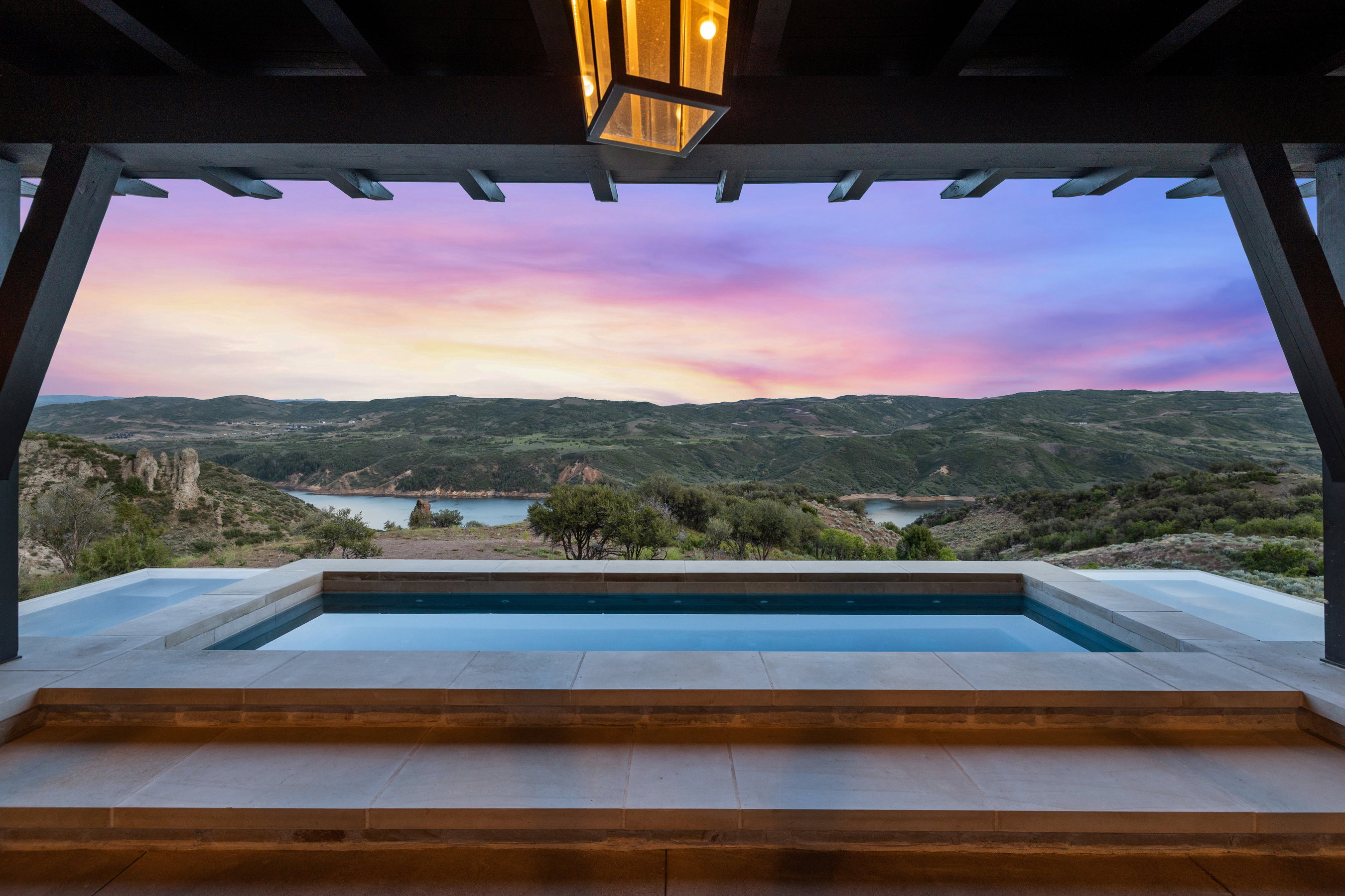 Outdoor plunge pool with stone coping and tile surround